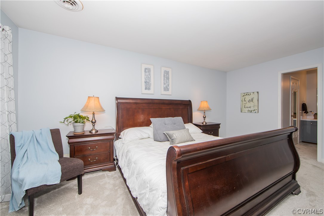 807 Dawnwood Road Midlothian, VA 23114 - Photo 17 of 37 a bedroom with a bed and a couch