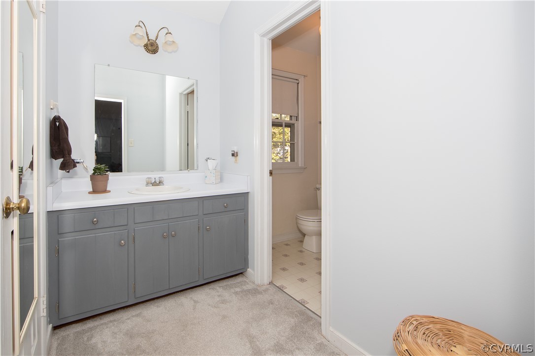 807 Dawnwood Road Midlothian, VA 23114 - Photo 18 of 37 a spacious bathroom with a double vanity sink and a mirror
