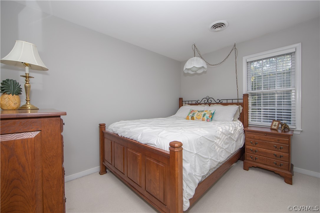 807 Dawnwood Road Midlothian, VA 23114 - Photo 20 of 37 a bedroom with a bed dresser and a window