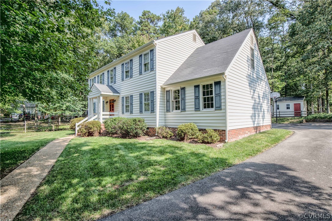 807 Dawnwood Road Midlothian, VA 23114 - Photo 2 of 37 a view of a house with a yard and plants