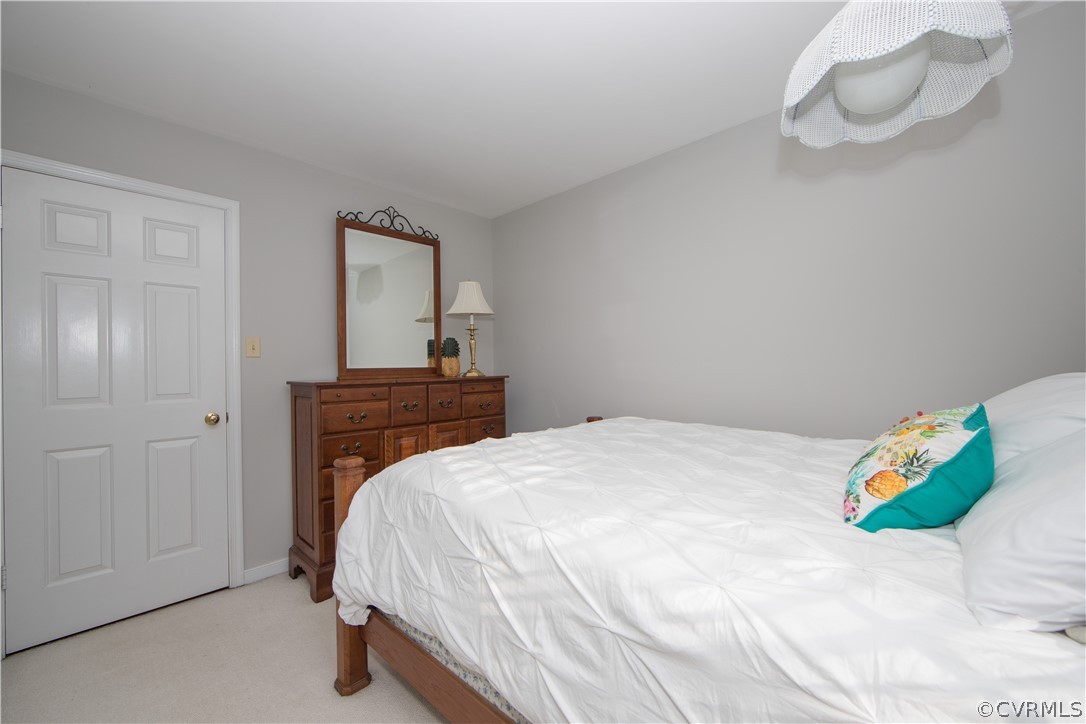 807 Dawnwood Road Midlothian, VA 23114 - Photo 21 of 37 a bedroom with a bed and a window