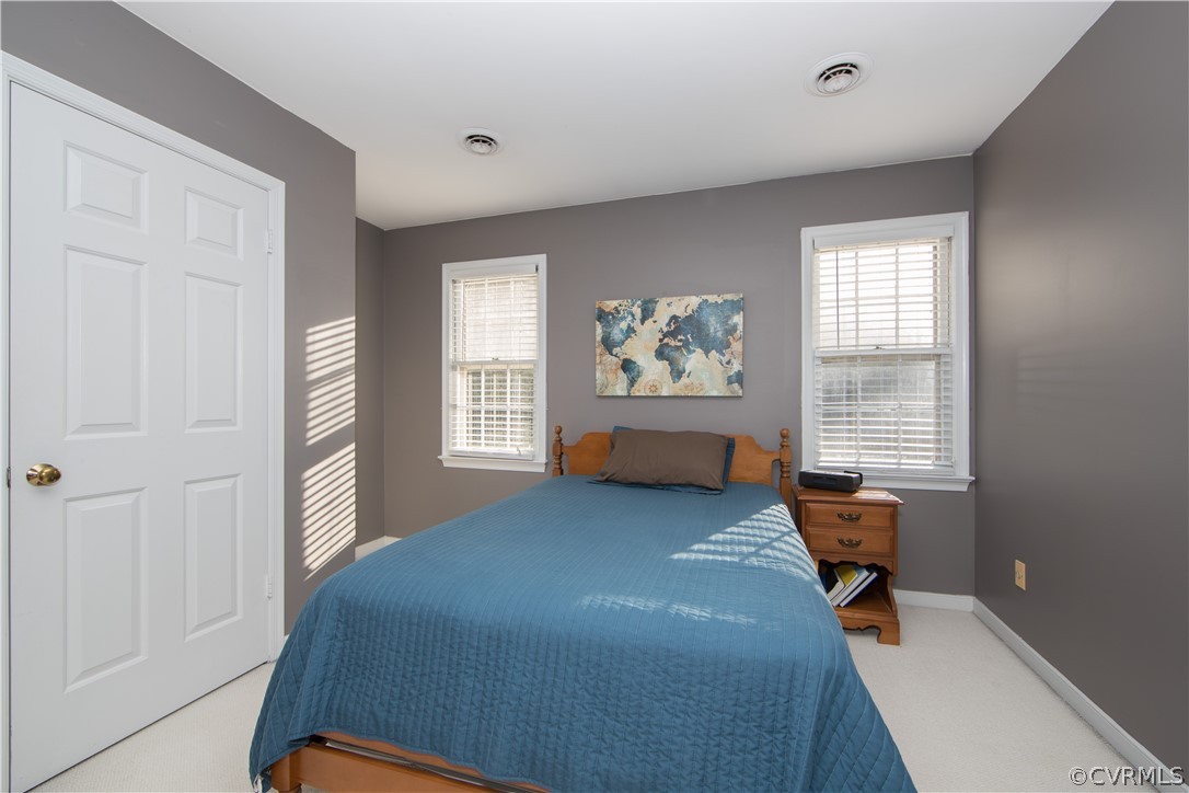 807 Dawnwood Road Midlothian, VA 23114 - Photo 22 of 37 a bedroom with a bed and wooden floor