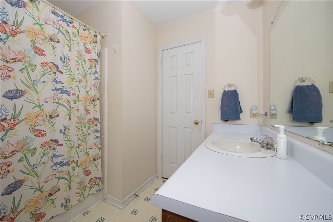 807 Dawnwood Road Midlothian, VA 23114 - Photo 28 of 37 a bathroom with a sink and a mirror