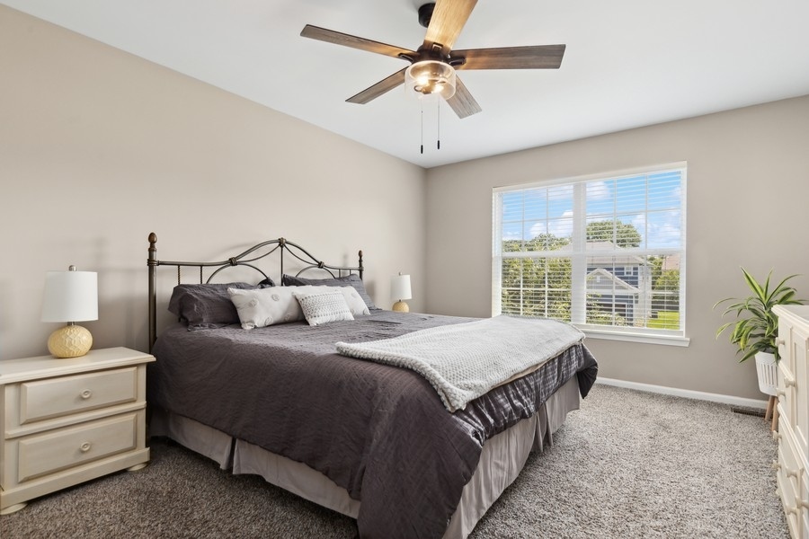2415 Fen View Circle Island Lake, IL 60042 - Photo 11 of 27 a bedroom with a bed and window