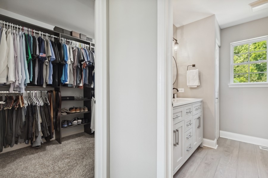 2415 Fen View Circle Island Lake, IL 60042 - Photo 12 of 27 a view of walk in closet with clothes and shoes
