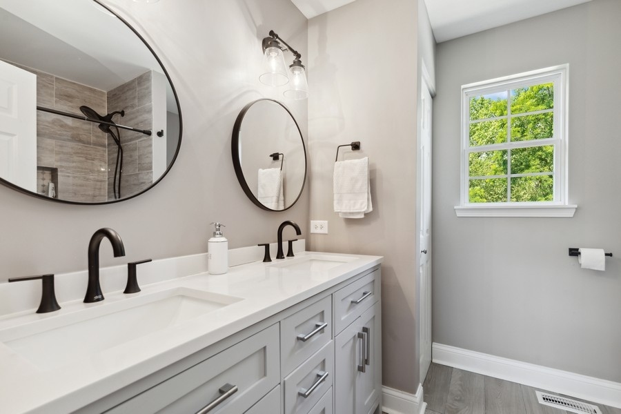 2415 Fen View Circle Island Lake, IL 60042 - Photo 13 of 27 a bathroom with a sink and a mirror