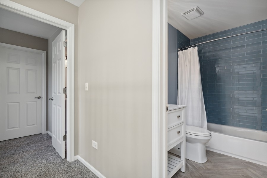 2415 Fen View Circle Island Lake, IL 60042 - Photo 19 of 27 a bathroom with a toilet and a shower