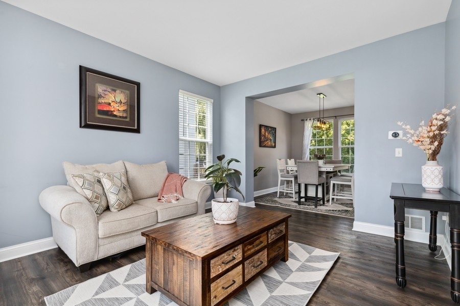 2415 Fen View Circle Island Lake, IL 60042 - Photo 2 of 27 a living room with furniture a wooden floor and a potted plant