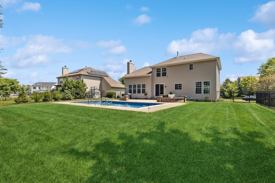 2415 Fen View Circle Island Lake, IL 60042 - Photo 21 of 27 a view of a white house with a big yard plants and large trees