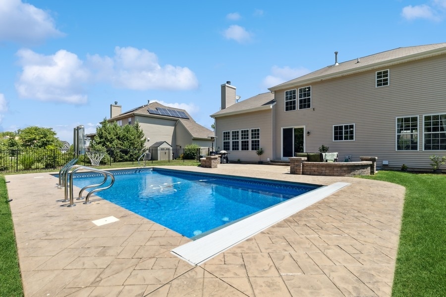 2415 Fen View Circle Island Lake, IL 60042 - Photo 22 of 27 a view of a house with swimming pool and sitting area