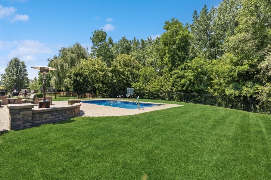 2415 Fen View Circle Island Lake, IL 60042 - Photo 23 of 27 a view of a swimming pool and a yard
