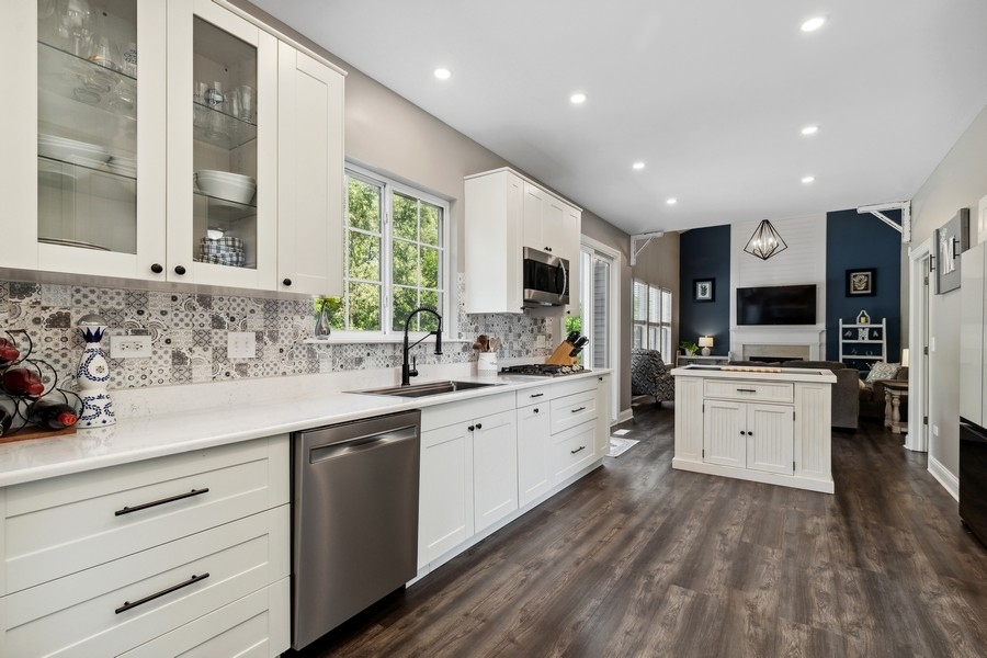 2415 Fen View Circle Island Lake, IL 60042 - Photo 5 of 27 a kitchen with white cabinets and white appliances