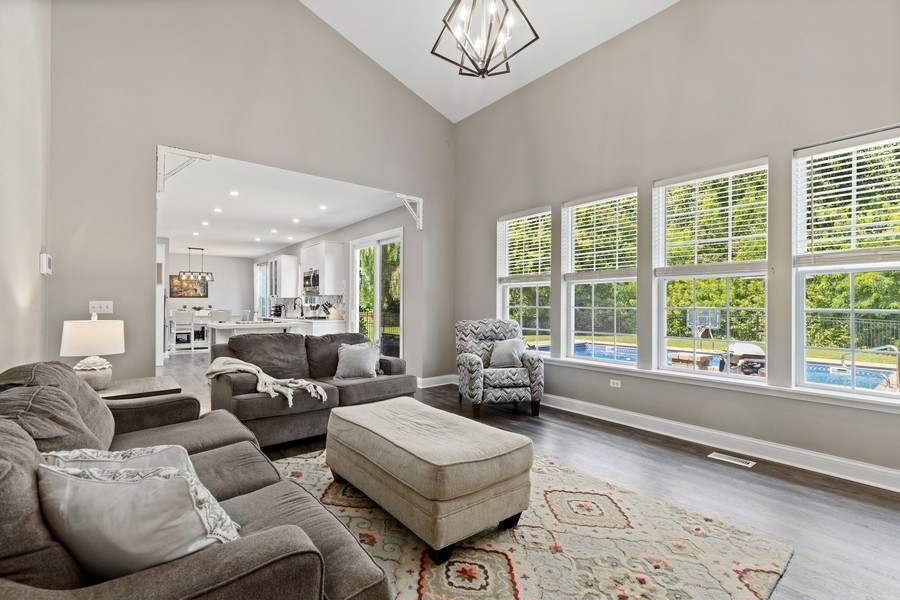 2415 Fen View Circle Island Lake, IL 60042 - Photo 8 of 27 a living room with furniture and a large window
