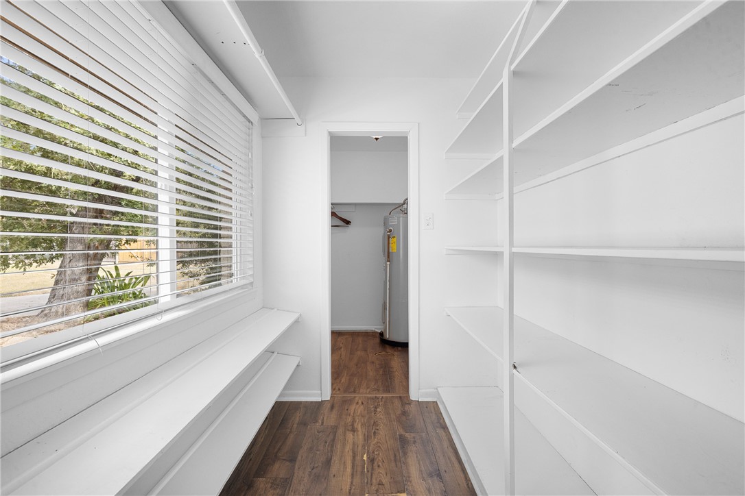 1027 Shadylane Drive Lexington, TX 78947 - Photo 25 of 45 a view of hallway with a large window and wooden floor