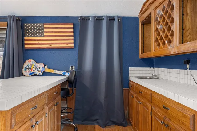a bathroom with a sink a vanity and a window