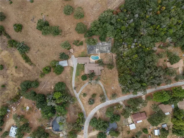an aerial view of residential house with outdoor space