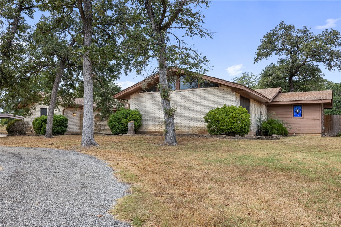 1027 Shadylane Drive Lexington, TX 78947 - Photo 4 of 45 a view of a house with a yard and garage