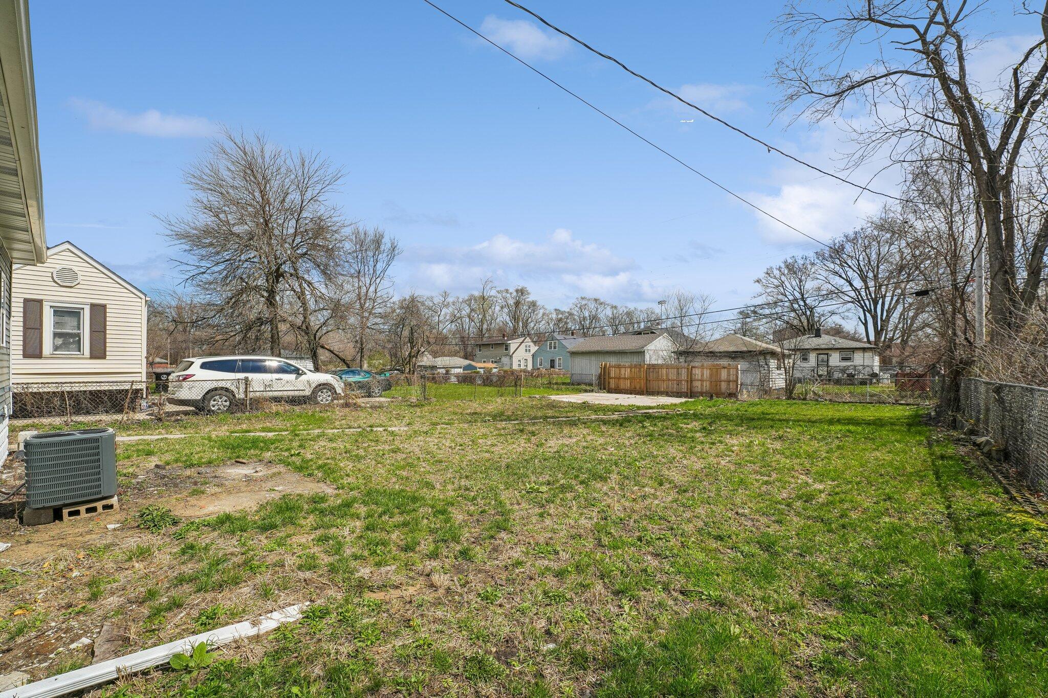 1043 Colfax Street Gary, IN 46406 - Photo 15 of 15 a front view of a house with a garden and lake view