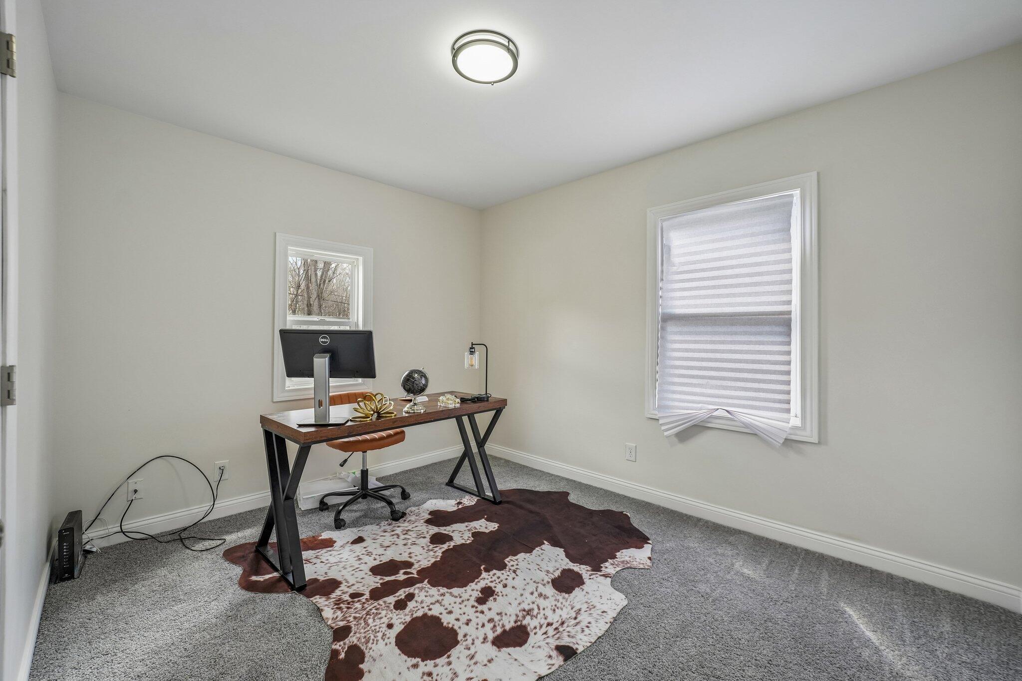 1043 Colfax Street Gary, IN 46406 - Photo 10 of 15 a work room with furniture and a window