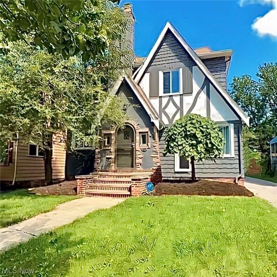 Tudor house with a front yard