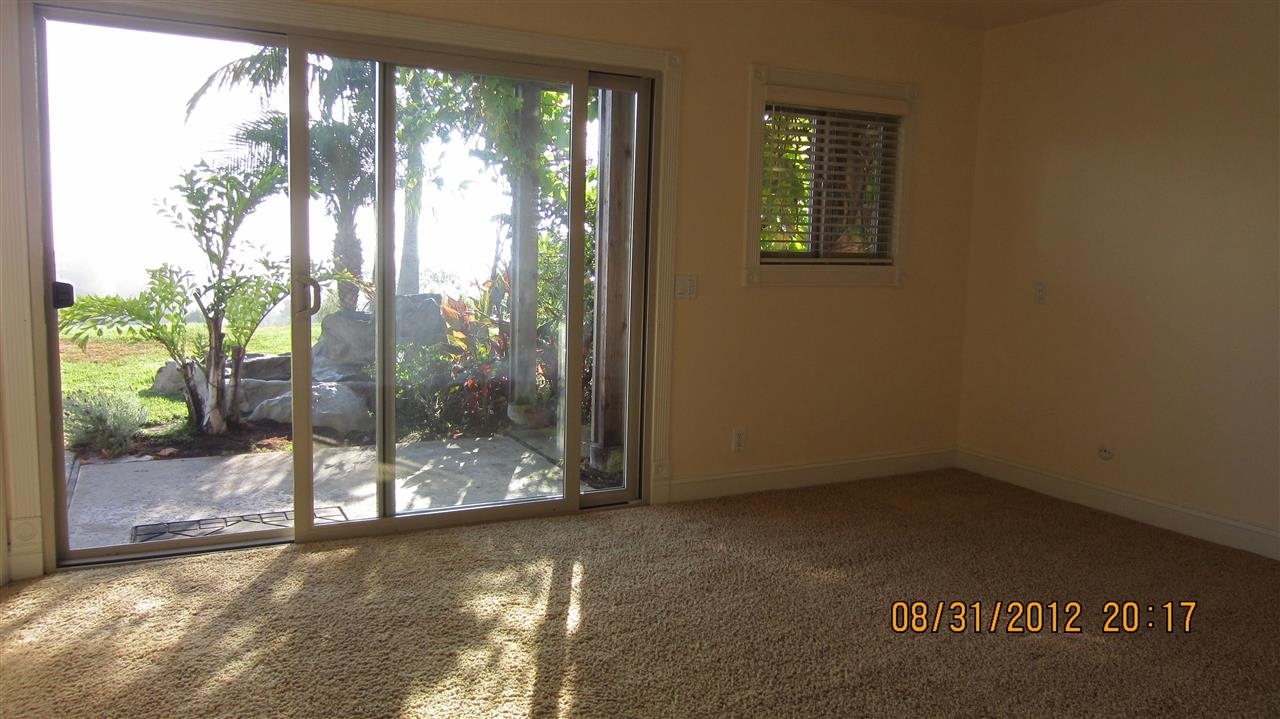 321 Trailview Road Encinitas, CA 92024 - Photo 14 of 25 Master Bedroom leads out to back yard and waterfall.