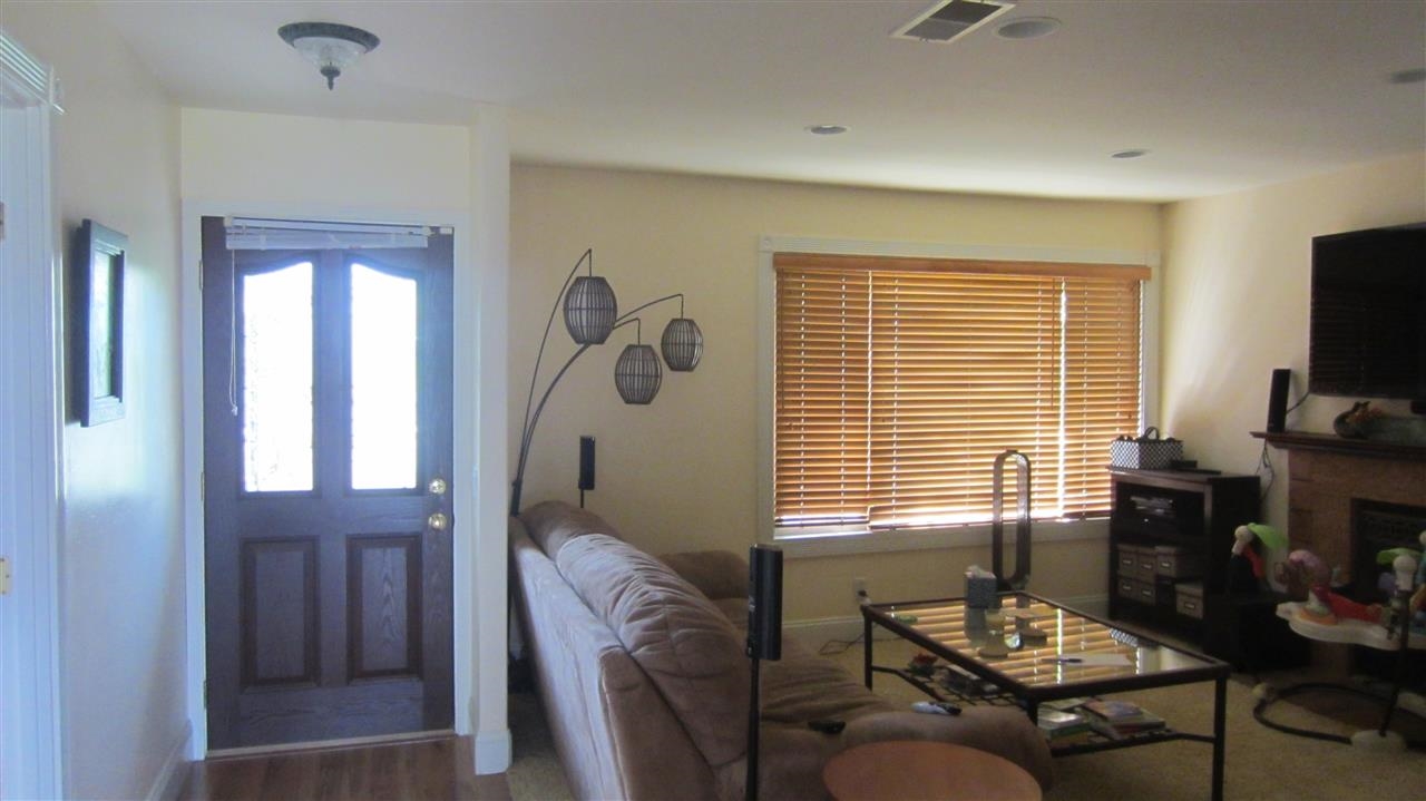 321 Trailview Road Encinitas, CA 92024 - Photo 8 of 25 Living Room with Fireplace, wood blinds.