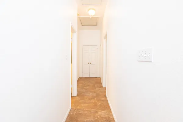 a view of a hallway with windows