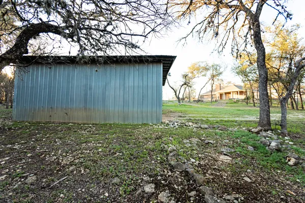 a view of outdoor space with trees all around