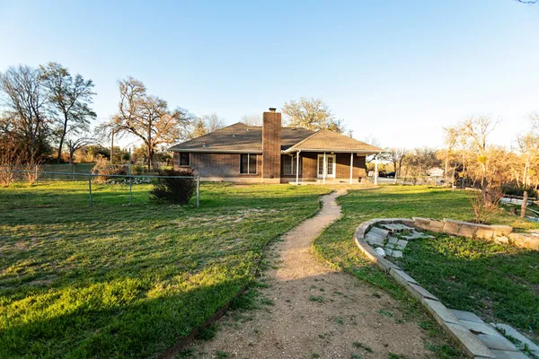 a backyard of a house with lots of green space