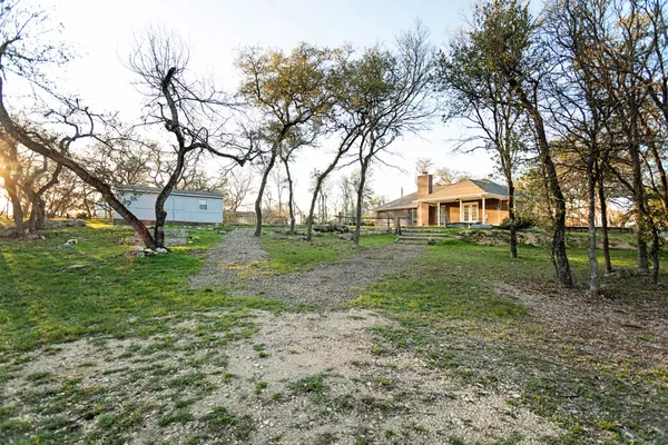 an aerial view of house with yard