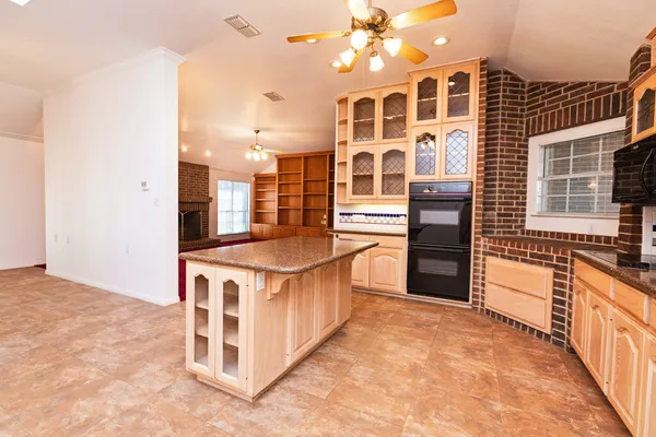 a kitchen with stainless steel appliances granite countertop a stove and a sink