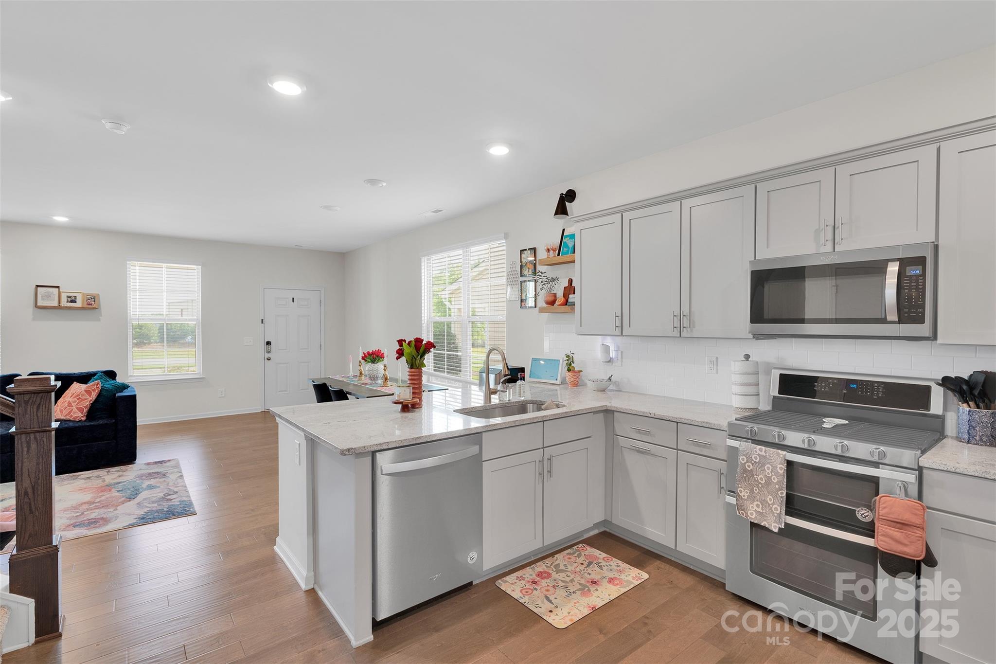 2131 Stevens Mill Road Matthews, NC 28104 - Photo 13 of 27 a kitchen with a sink appliances and cabinets
