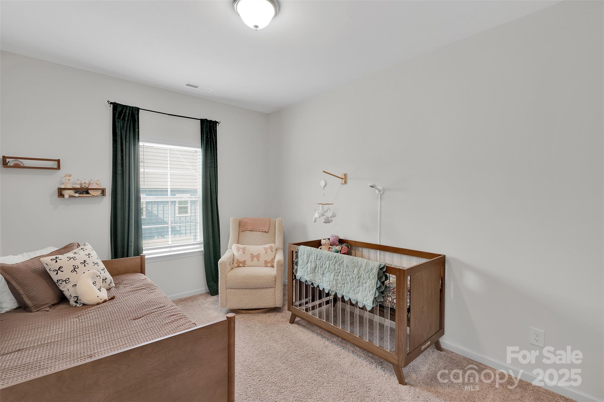 2131 Stevens Mill Road Matthews, NC 28104 - Photo 17 of 27 a bedroom with furniture and a window