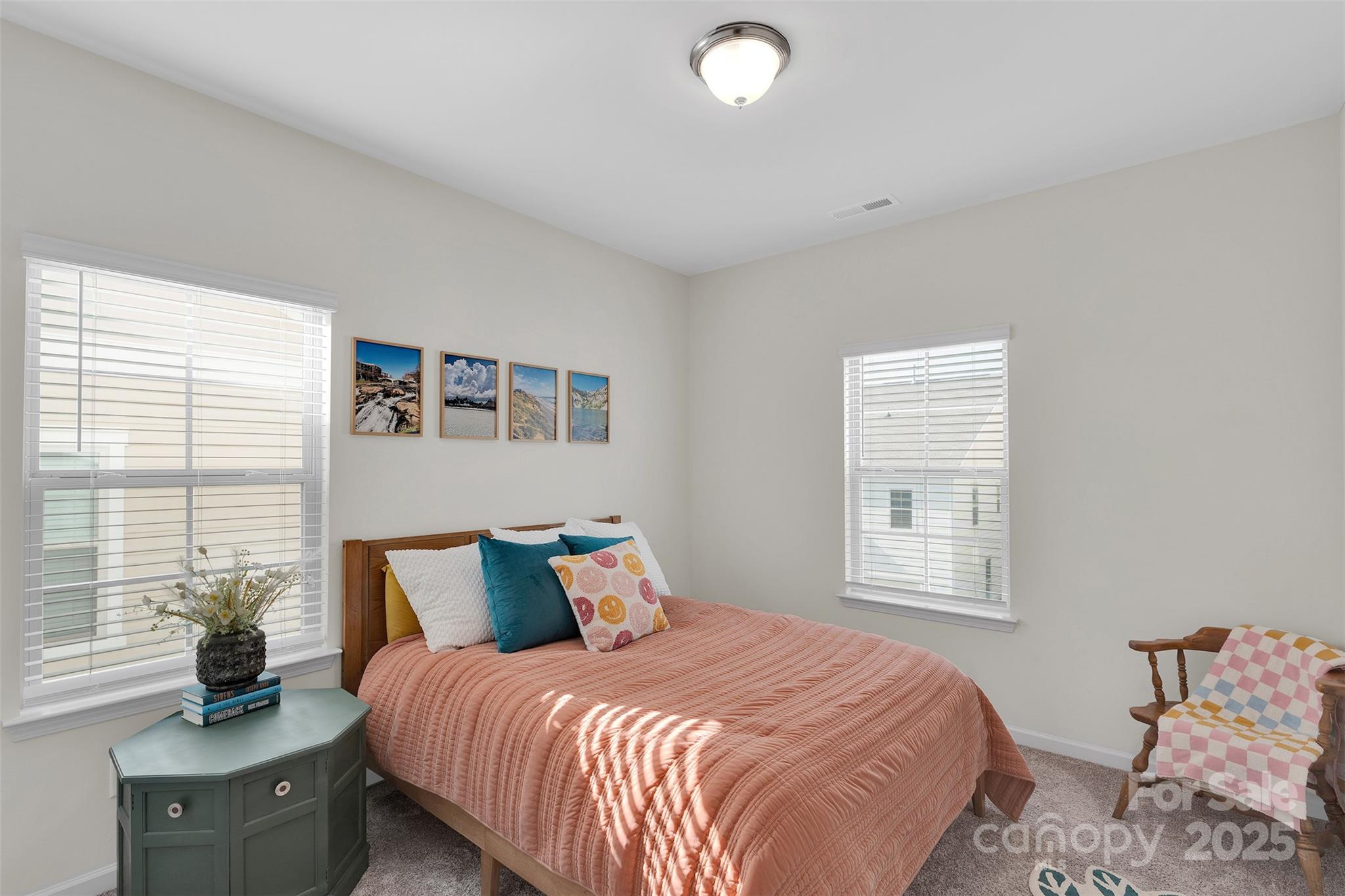 2131 Stevens Mill Road Matthews, NC 28104 - Photo 19 of 27 a bedroom with a bed and wooden floor