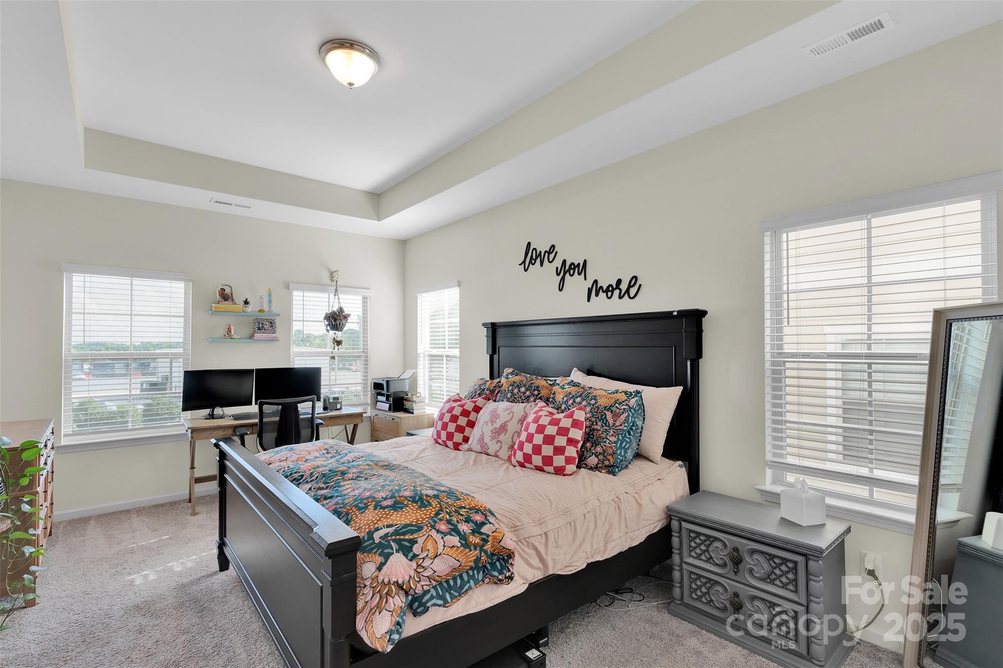 2131 Stevens Mill Road Matthews, NC 28104 - Photo 24 of 27 a bedroom with a bed and wooden floor