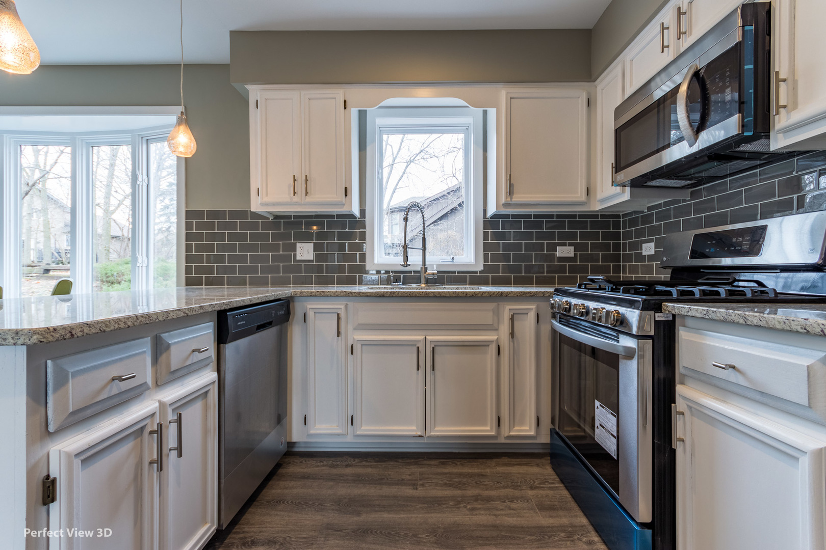 1100 West Seil Road Shorewood, IL 60404 - Photo 13 of 30 a kitchen with stainless steel appliances granite countertop a stove sink and cabinets