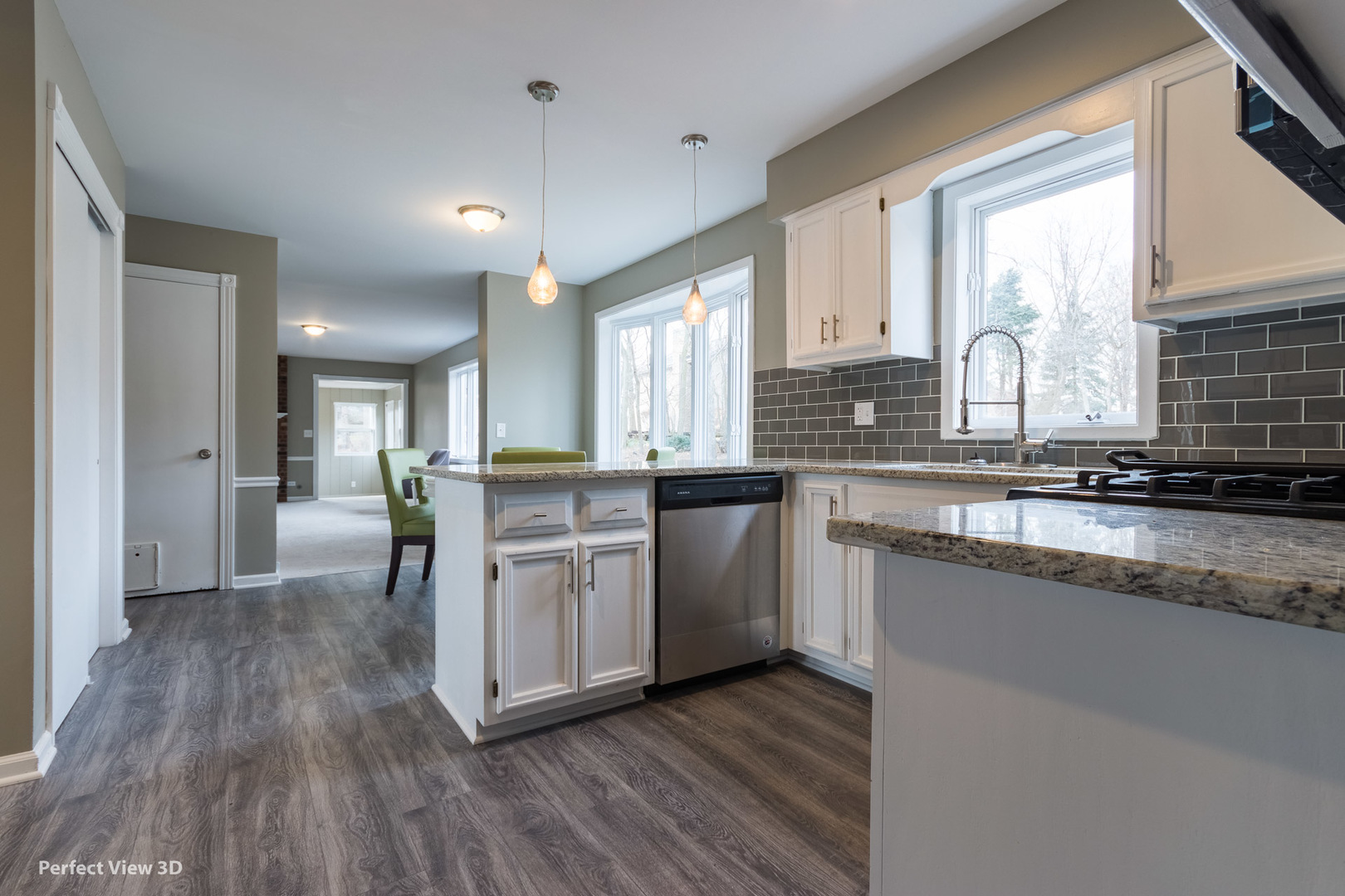 1100 West Seil Road Shorewood, IL 60404 - Photo 14 of 30 a kitchen with wooden floors and white cabinets