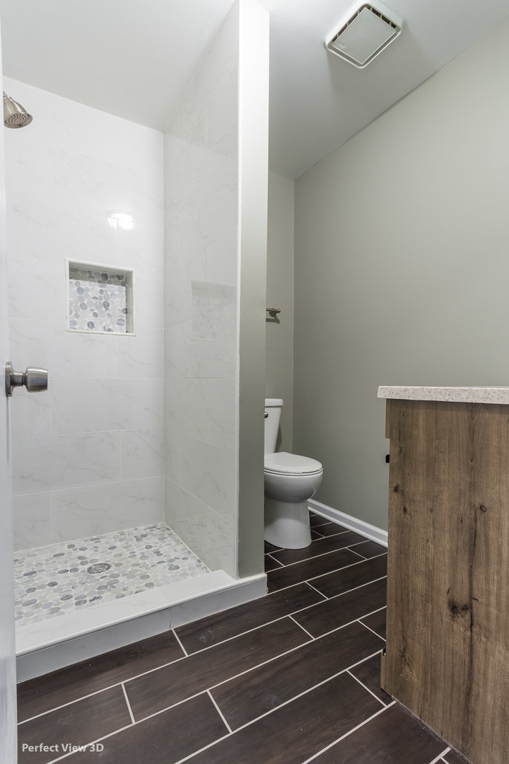 1100 West Seil Road Shorewood, IL 60404 - Photo 17 of 30 a bathroom with a sink and a shower