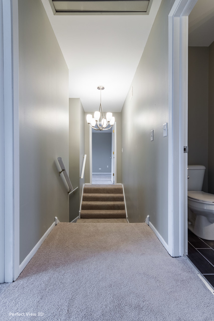 1100 West Seil Road Shorewood, IL 60404 - Photo 22 of 30 a view of entryway and hall with a chair