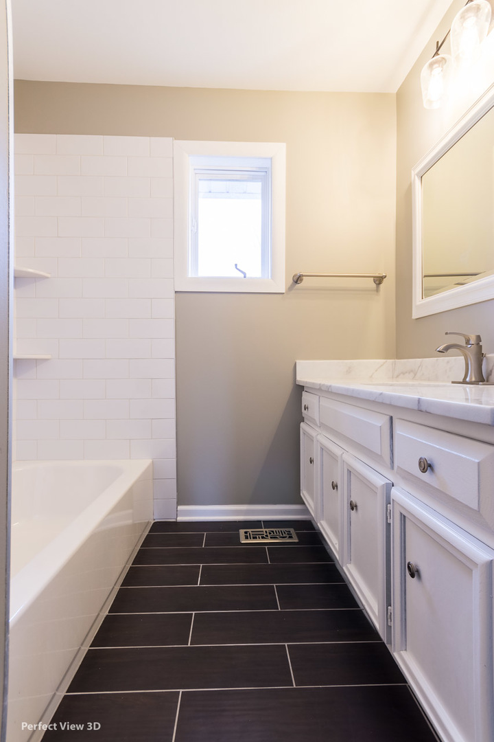 1100 West Seil Road Shorewood, IL 60404 - Photo 23 of 30 a bathroom with a sink and a bathtub