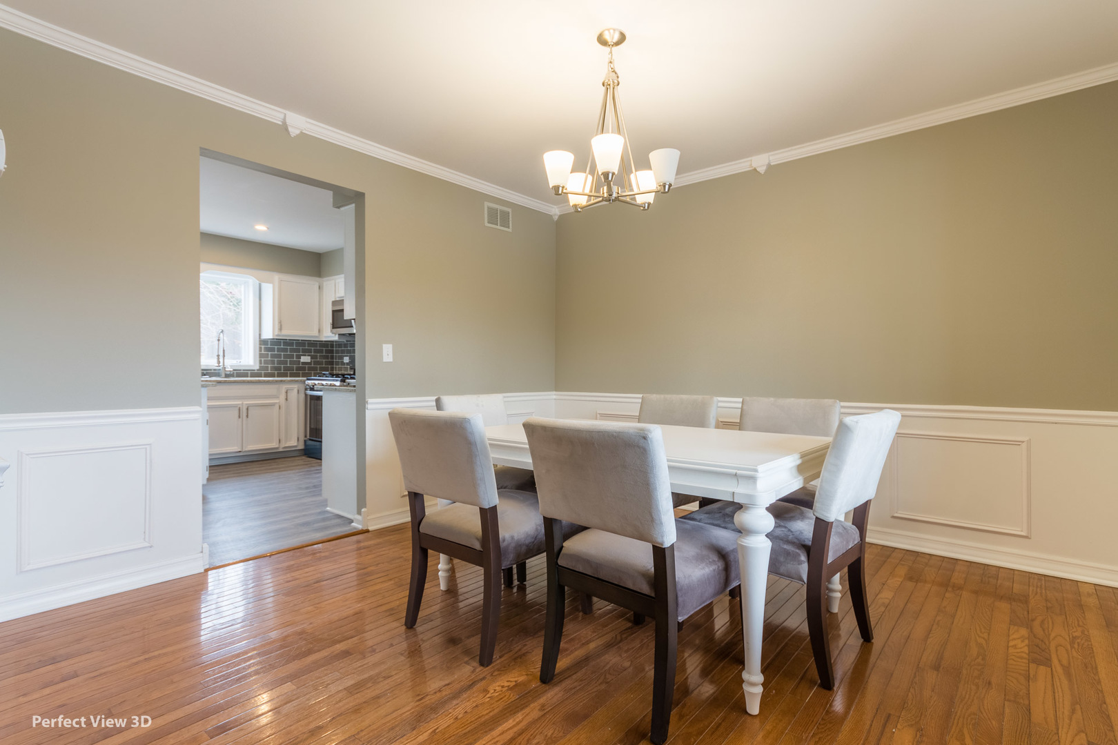 1100 West Seil Road Shorewood, IL 60404 - Photo 3 of 30 a view of a dining room with furniture and wooden floor