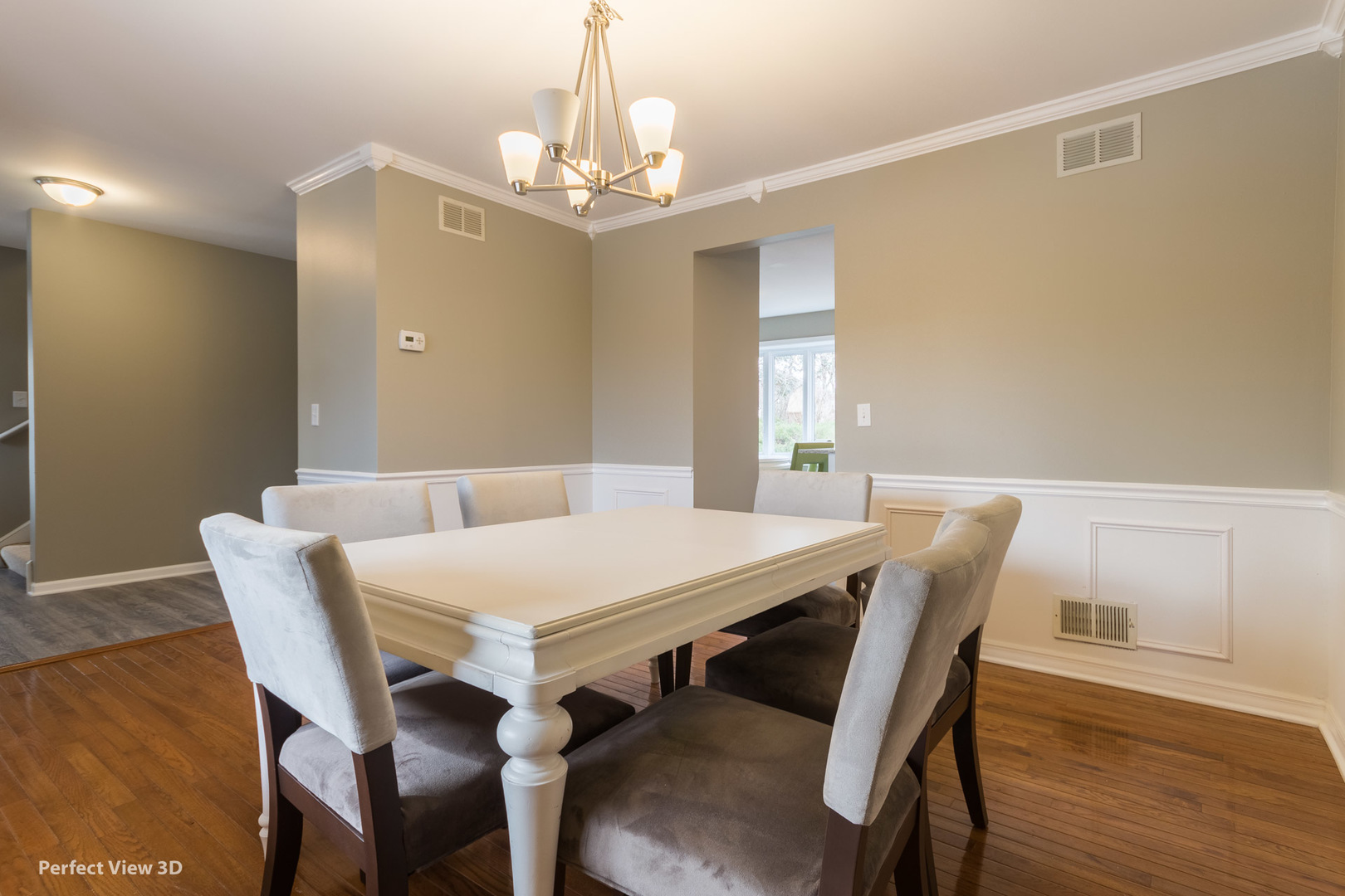 1100 West Seil Road Shorewood, IL 60404 - Photo 4 of 30 a view of a dining room with furniture and wooden floor