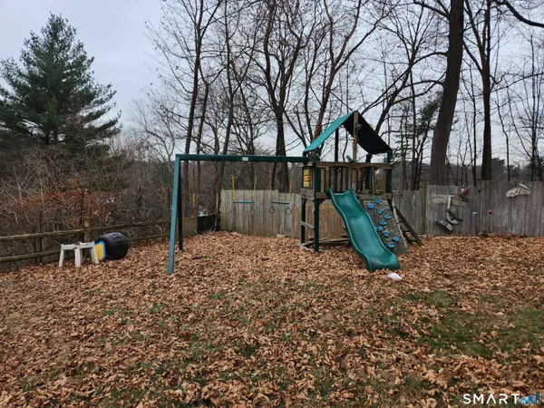 a backyard of a house with barbeque oven