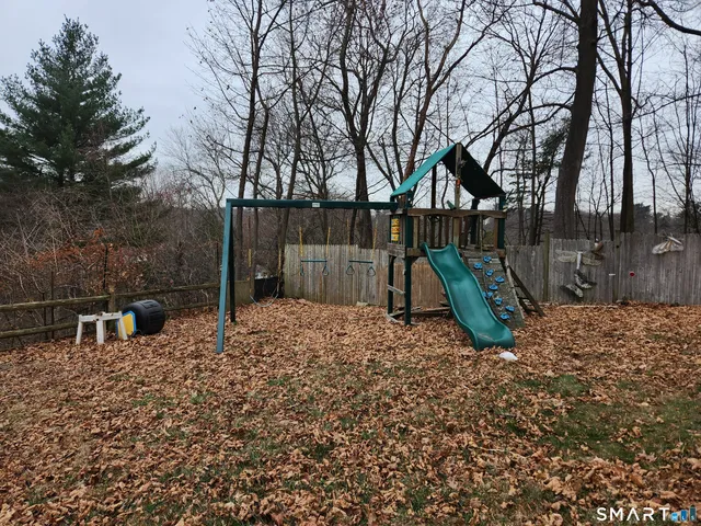 a backyard of a house with barbeque oven