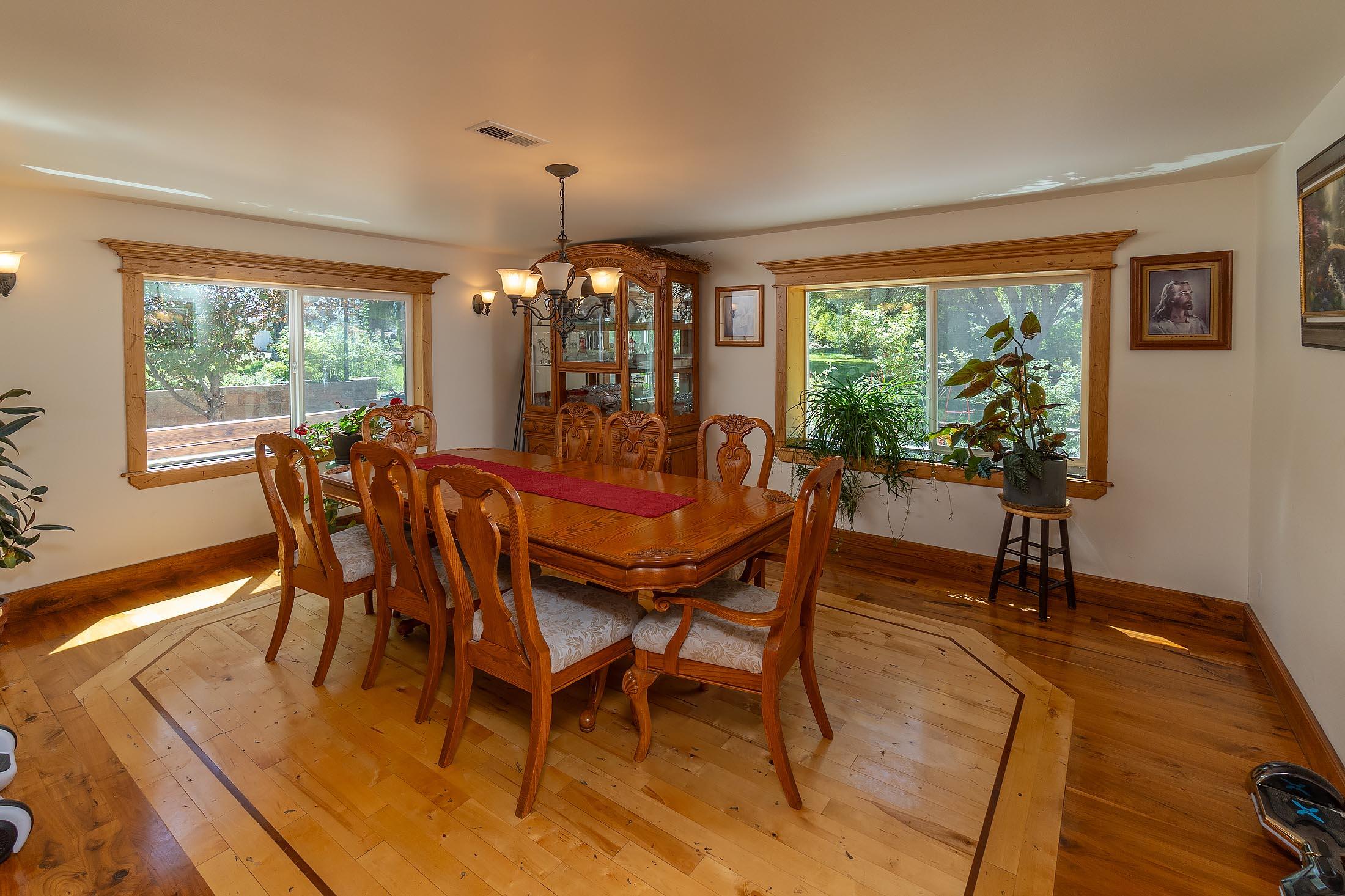 59047 Old Lake Road Christmas Valley, OR 97641 - Photo 39 of 55 Exquisite formal dining room with inlaid flooring of Belizean rosewood, black walnut, and hickory