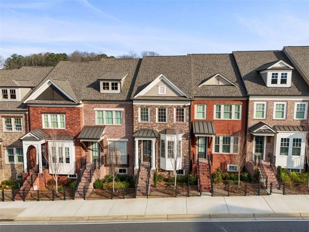 4466 Lemon Street Acworth, GA 30101 - Photo 6 of 65 a front view of a residential apartment building with a yard