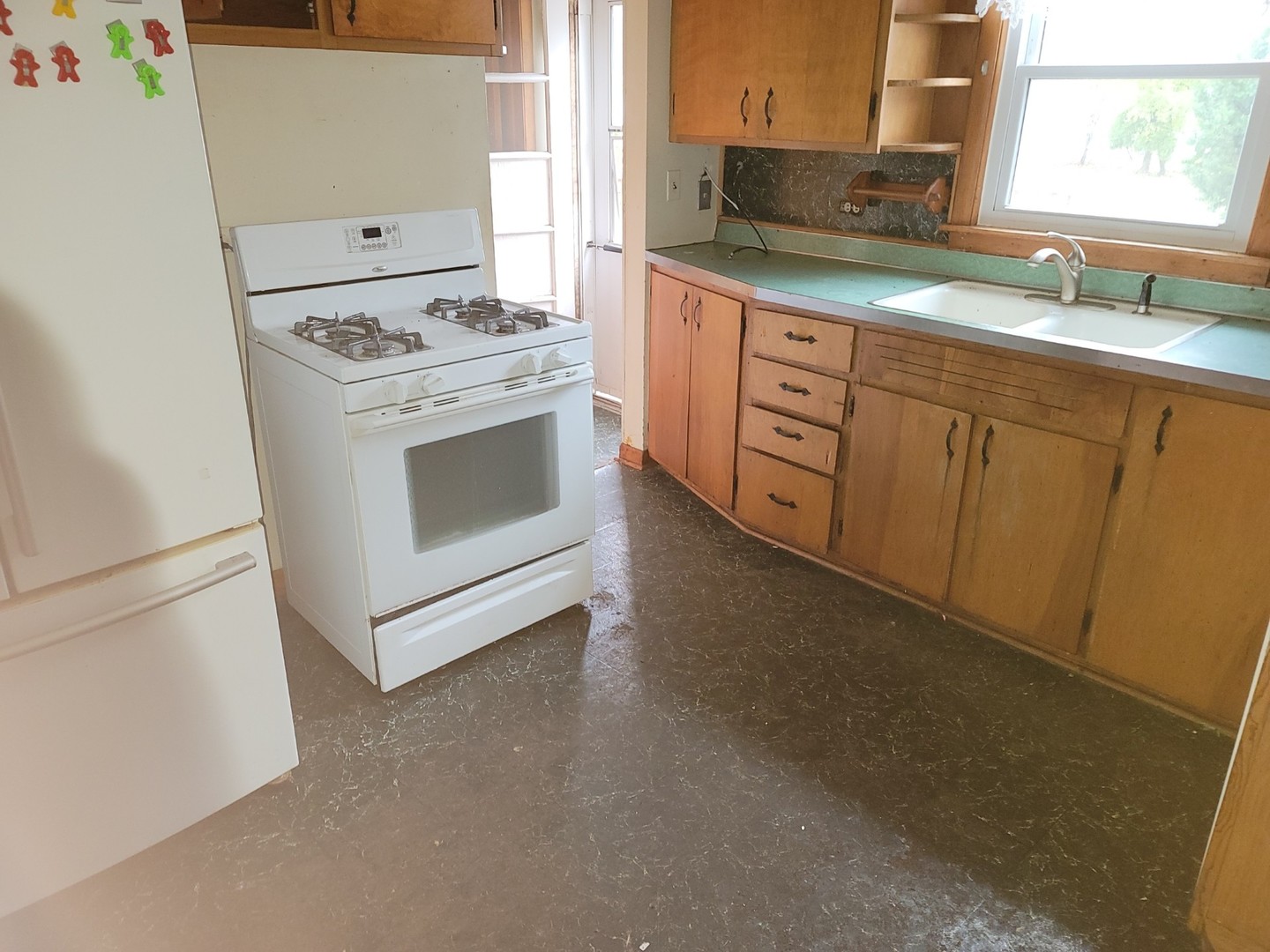 213 South Summit Street Wheaton, IL 60187 - Photo 6 of 33 a kitchen with stainless steel appliances granite countertop a stove sink and cabinets