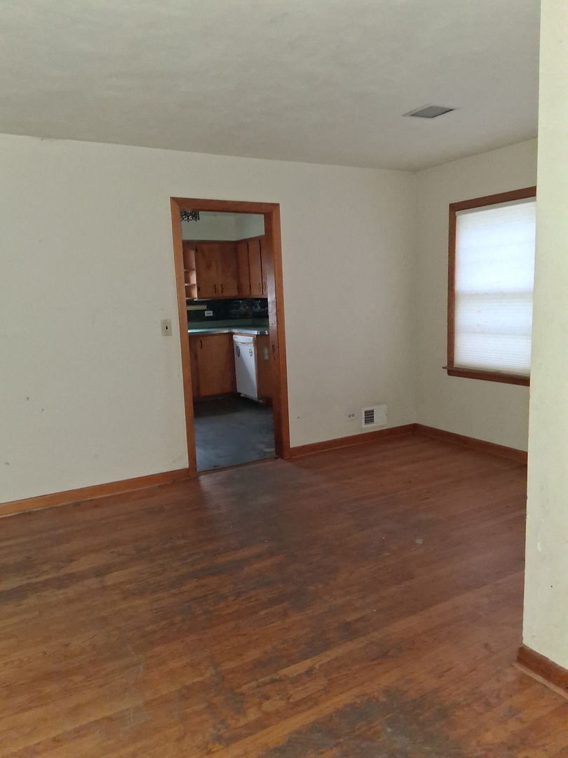213 South Summit Street Wheaton, IL 60187 - Photo 9 of 33 a view of a room with wooden floor and kitchen view