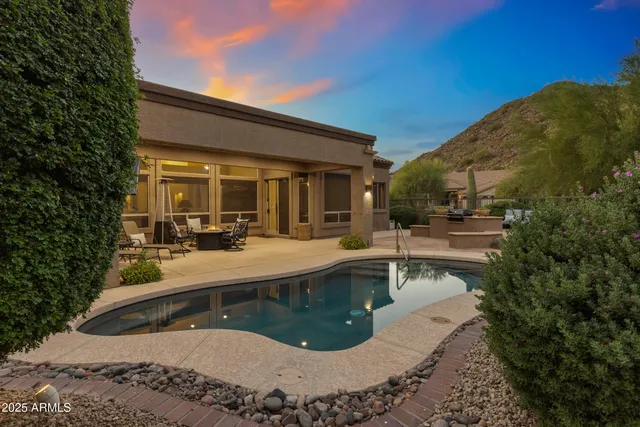 a view of a swimming pool with a patio
