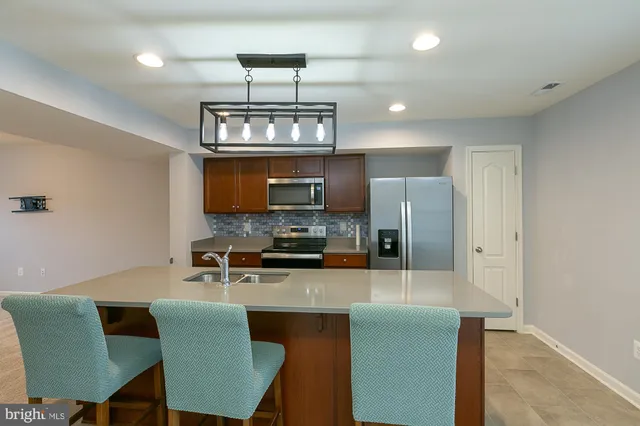 a view of a livingroom with a chandelier fan